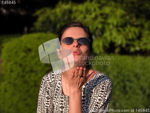 Image of Girl blowing a kiss