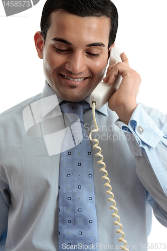 Image of Businessman communicating by telephone