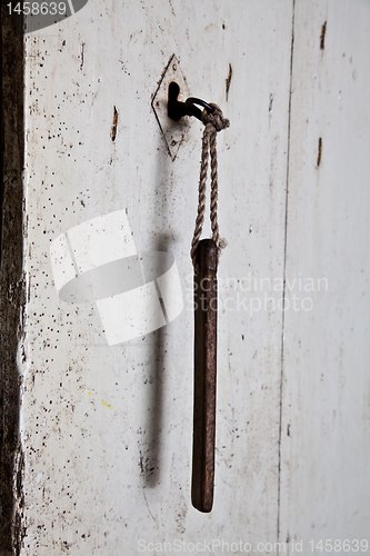 Image of Old key in old door