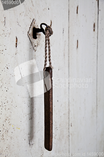 Image of Old key in old door