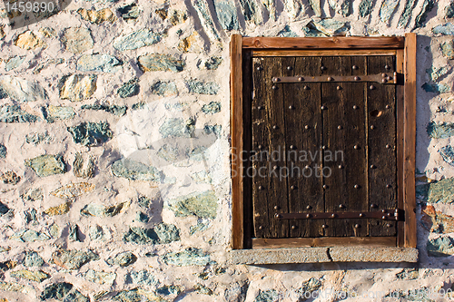 Image of Wood window on stone