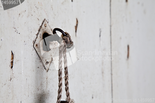 Image of Old key in old door