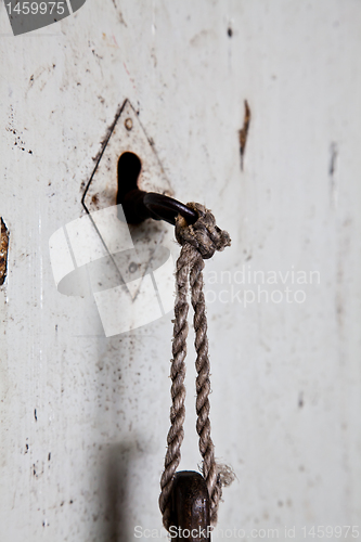 Image of Old key in old door