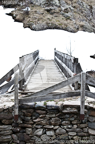 Image of Snow at the endo of the bridge