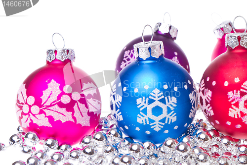 Image of christmas balls with snowflake symbols