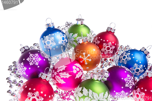 Image of christmas balls with snowflake symbols