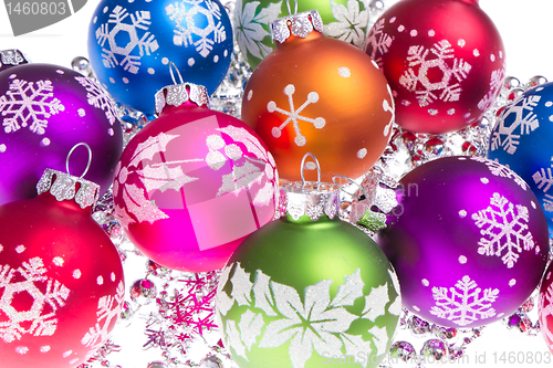 Image of christmas balls with snowflake symbols