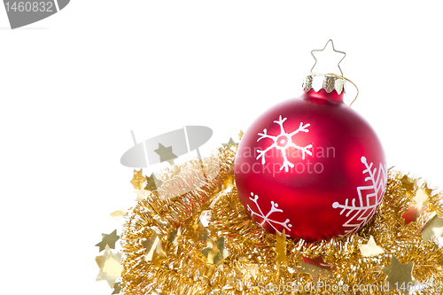 Image of christmas ball with snowflake symbols and tinsel