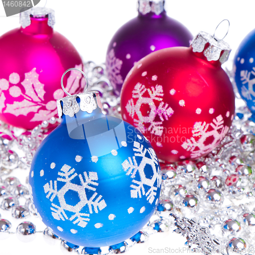 Image of christmas balls with snowflake symbols