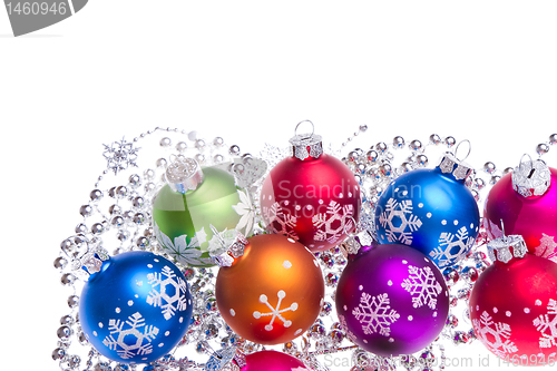 Image of christmas balls with snowflake symbols