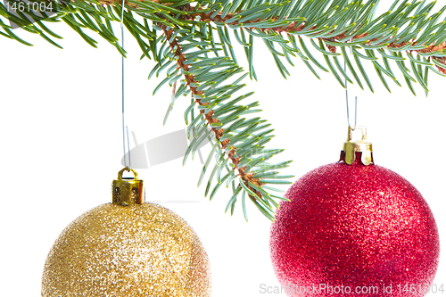 Image of red christmas ball hanging from tree