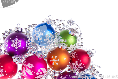 Image of christmas balls with snowflake symbols