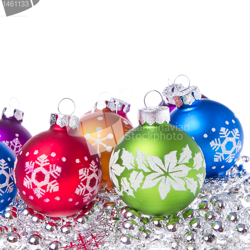 Image of christmas balls with snowflake symbols