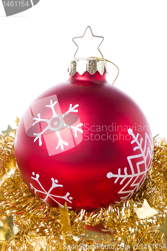 Image of christmas ball with snowflake symbols and tinsel