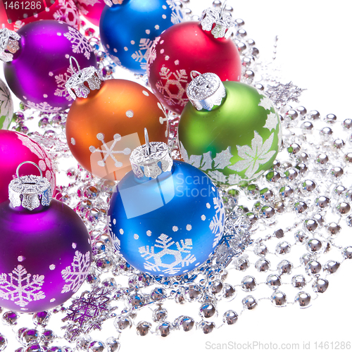 Image of christmas balls with snowflake symbols