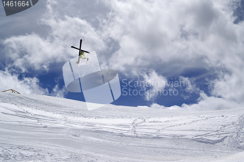 Image of Freestyle ski jumper with crossed skis