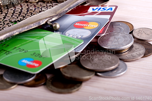 Image of wallet with credit cards and coins