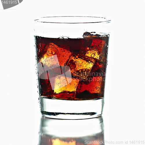Image of Fresh Cold Cola with ice in glass isolated on white background