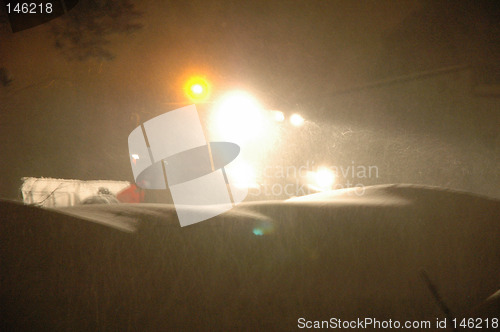 Image of Snowblowing action by night