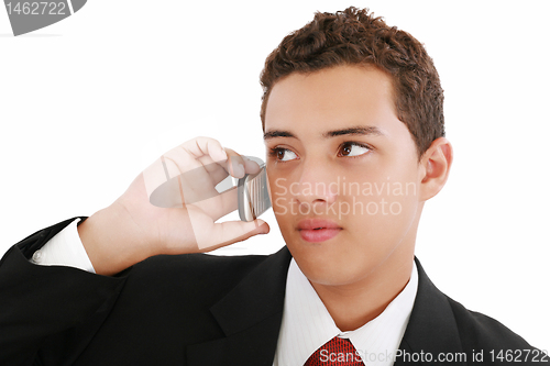 Image of Close-up of attractive young businessman on cellphone. Nineteen 