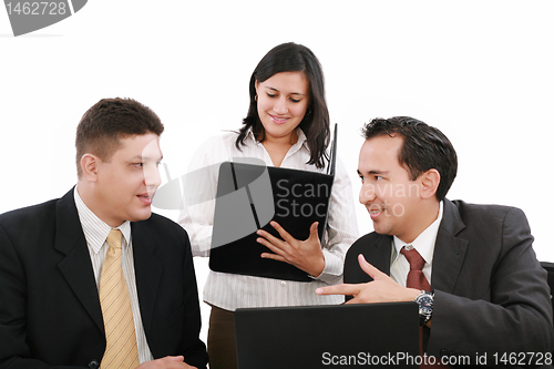 Image of Businesspeople working together at meeting table in office