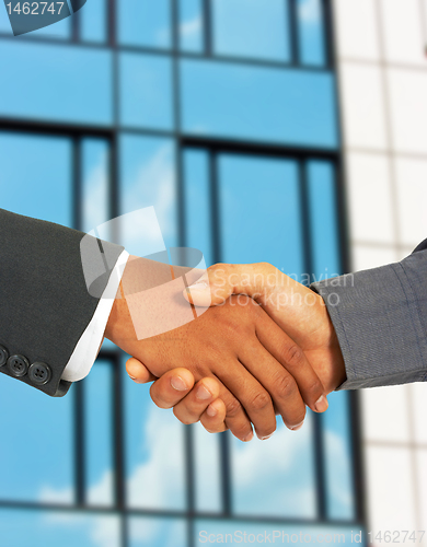 Image of Businessmen Greet Each Other By Shaking Hands