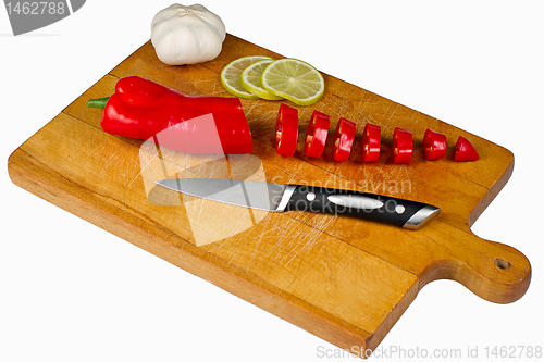 Image of Chopping Board with pepper lime and garlic