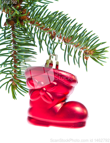 Image of red christmas star hanging from tree