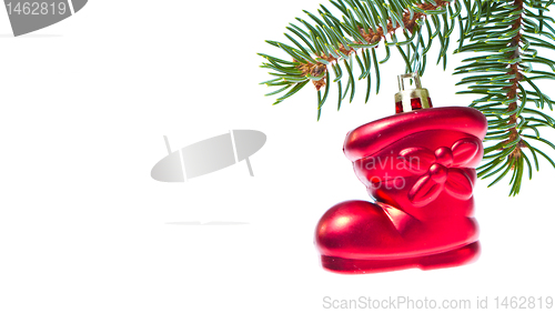 Image of red christmas star hanging from tree