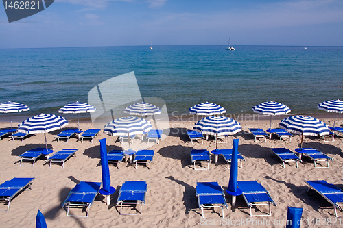 Image of beach with chairs and umbrellas