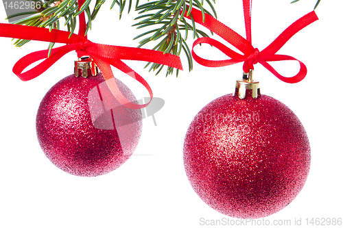 Image of red christmas ball hanging from tree