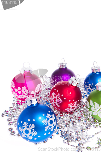 Image of christmas balls with snowflake symbols
