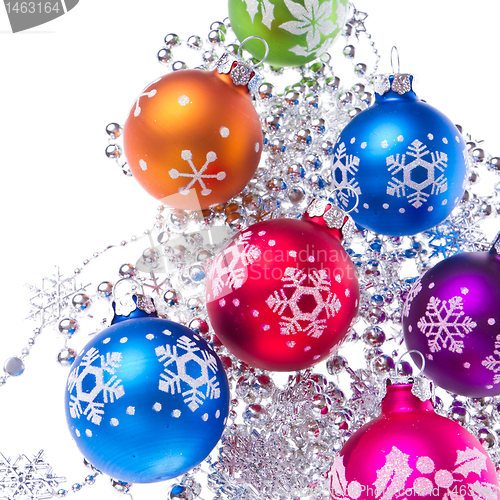 Image of christmas balls with snowflake symbols