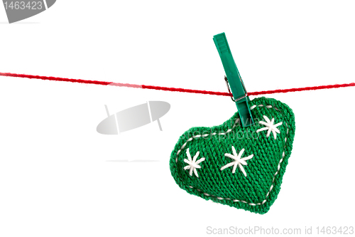 Image of single knitted green heart