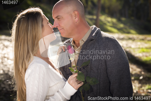 Image of Attractive Young Couple with Rose