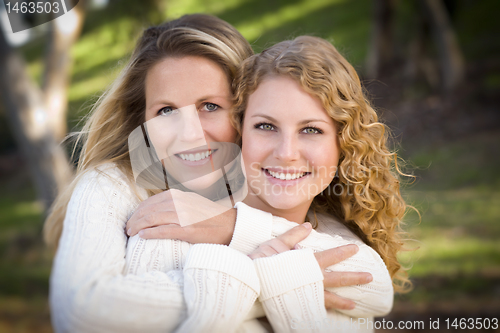 Image of Pretty Mother and Daughter Portrait in Park