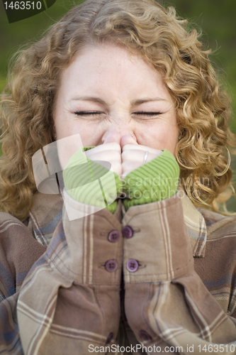 Image of Pretty Young Woman Sneezing