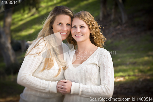 Image of Pretty Mother and Daughter Portrait in Park