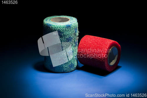 Image of Different colour medical bandages on studio floor