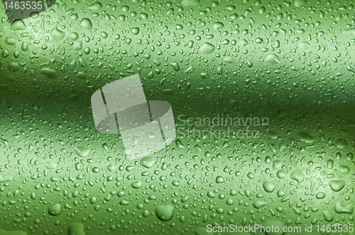 Image of Drops on green wavy background making texture