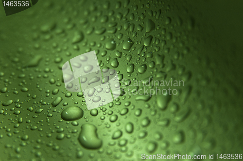 Image of Drops on green wavy background making texture