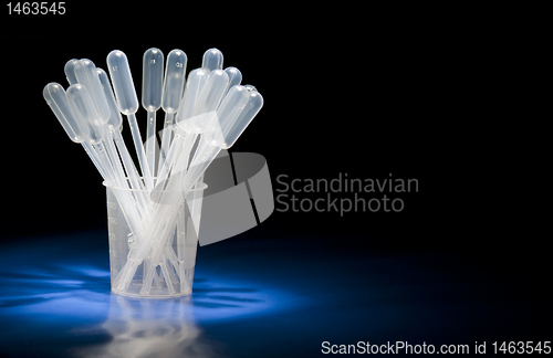 Image of Pipettes standing in glass in studio