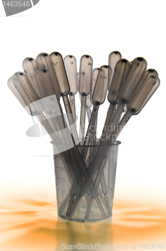 Image of Shaded pipettes standing placed in measure glass