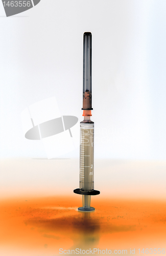 Image of Shaded medical syringe standing head up