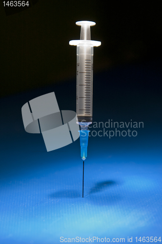 Image of Ready medical syringe standing head down