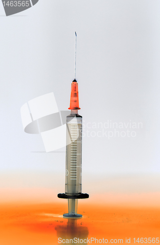 Image of Shaded medical syringe standing head up