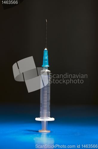 Image of Ready medical syringe standing head up