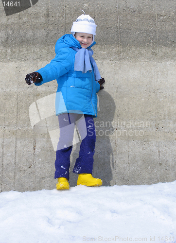 Image of Young girl near the concrete wall