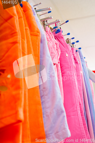 Image of children's trousers on a hanger in the store