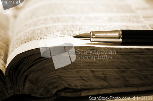 Image of Old book and pen